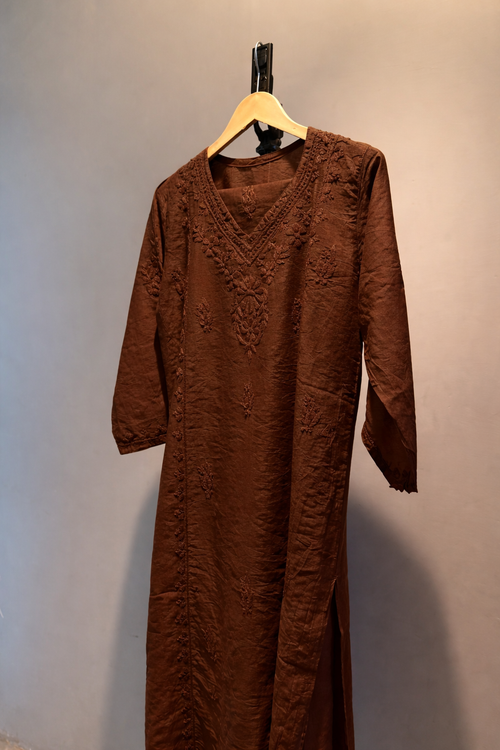 Elegant Chanderi Silk suit set adorned with delicate Chikankari embroidery — lightweight, graceful, and crafted for timeless festive sophistication.